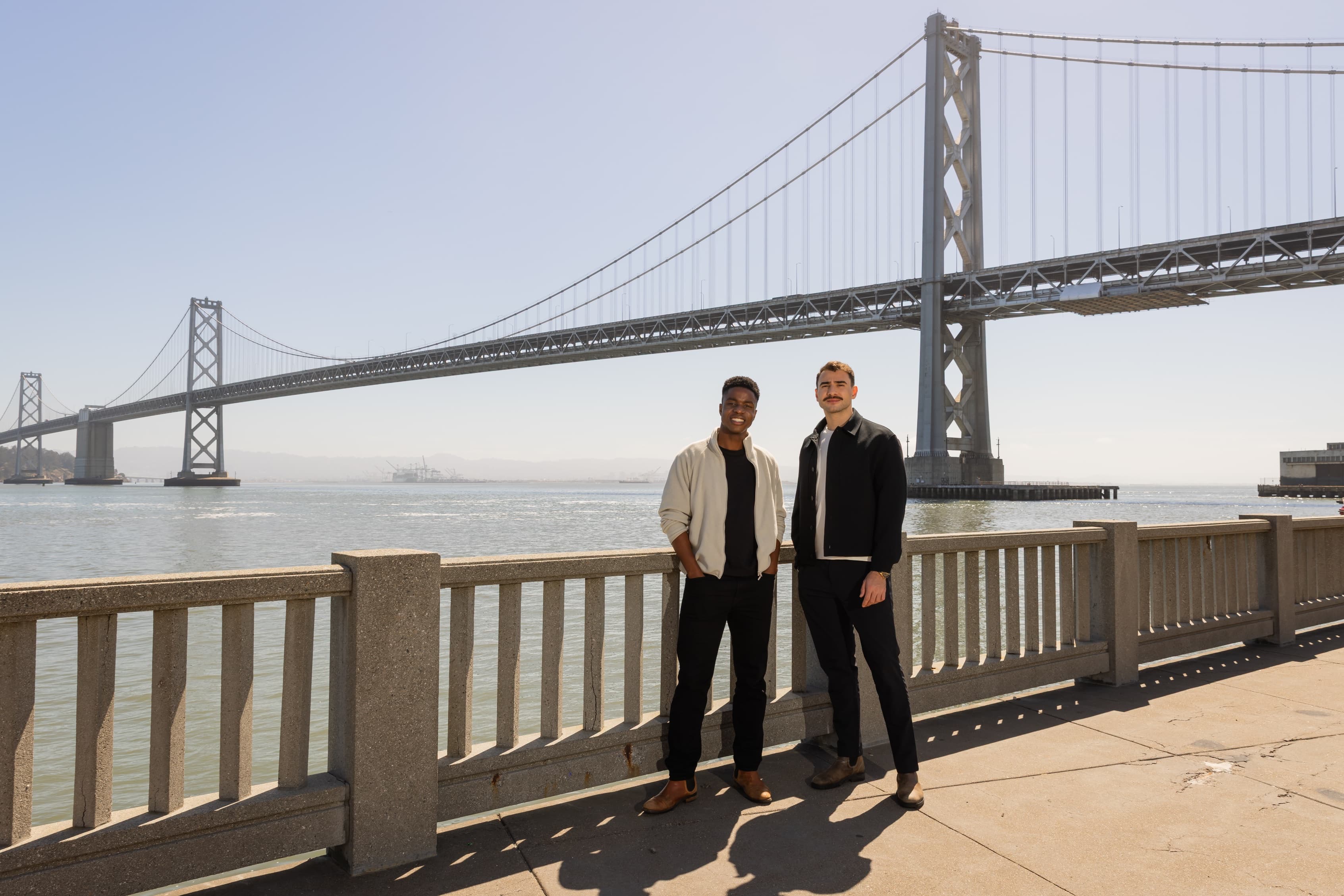 Orthogonal co-founders Christian Pickett and Bera Sogut in front of the Bay Bridge in San Francisco